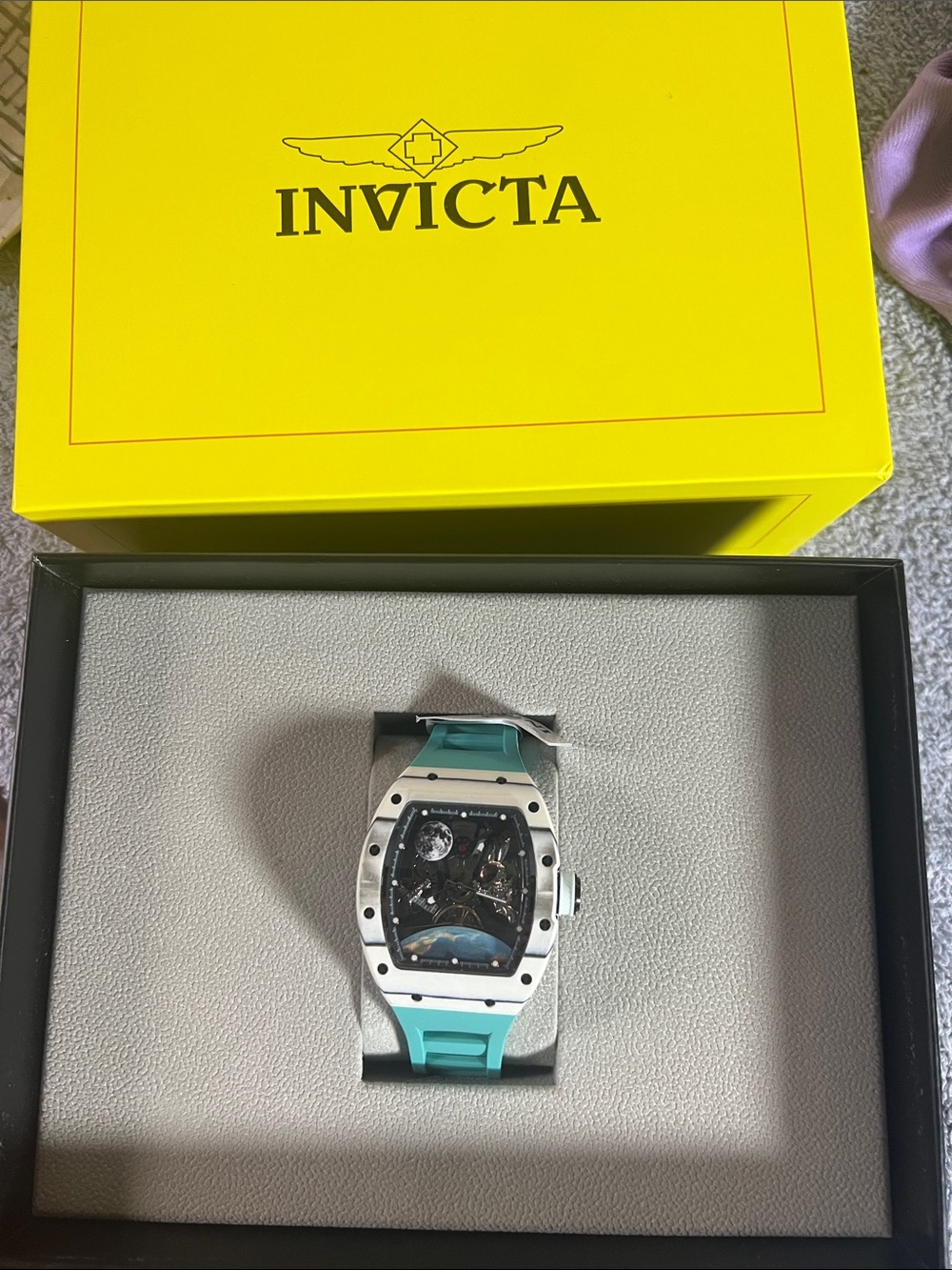 Invicta S1 Rally Interstellar 70179 automatic watch, featuring a white and teal
